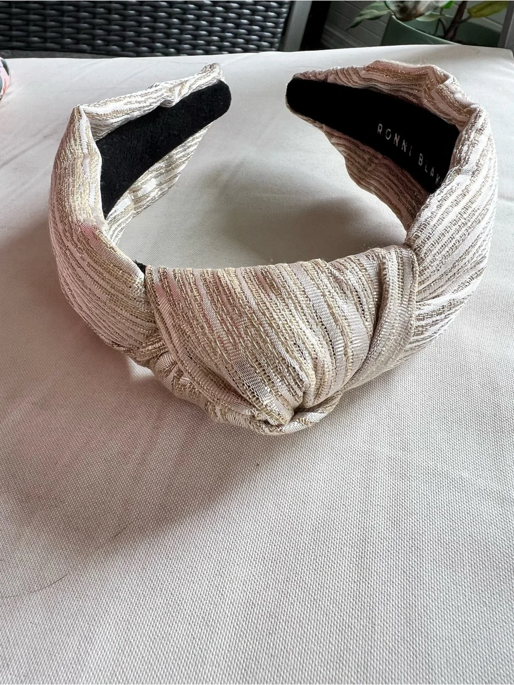 Package of six multi-color and brand headbands.
